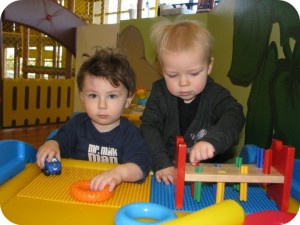 two toddler boys playing