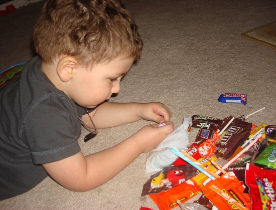 toddler with candy haul halloween