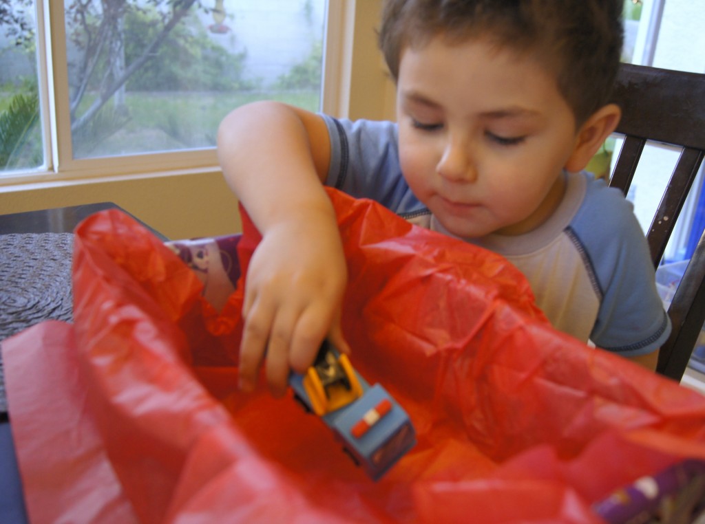 Preschooler donating toys