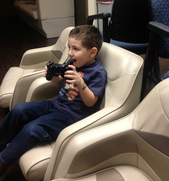 Kid playing Playstation Kid playing Playstation