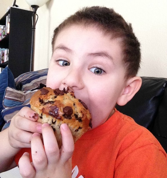 Little kid with BIG muffin Little kid with BIG muffin