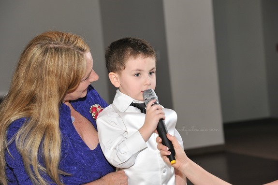 Son giving toast at wedding