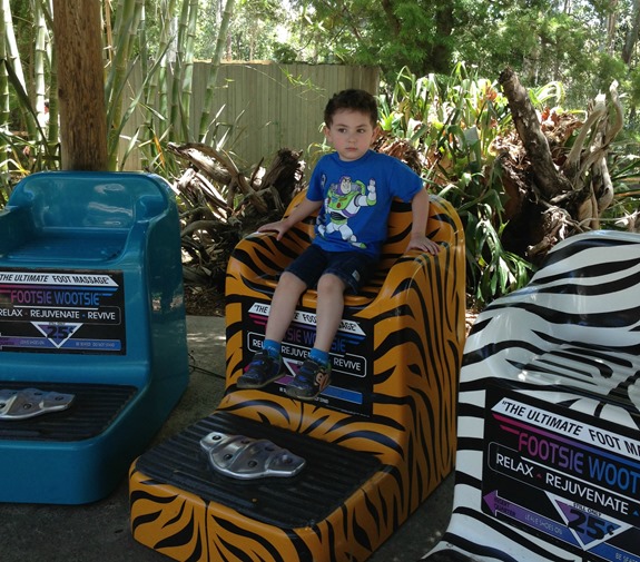 Shane posing on foot massager at San Diego Zoo Safari Park