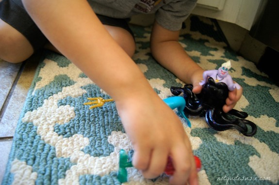 Shane playing with figurines