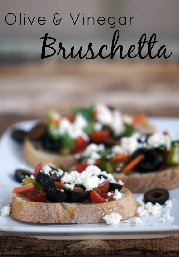 Olive and Vinegar Bruschetta- a quick and easy appetizer recipe featuring olives, balsamic vinegar, and red wine vinaigrette as the not-so-secret ingredient!