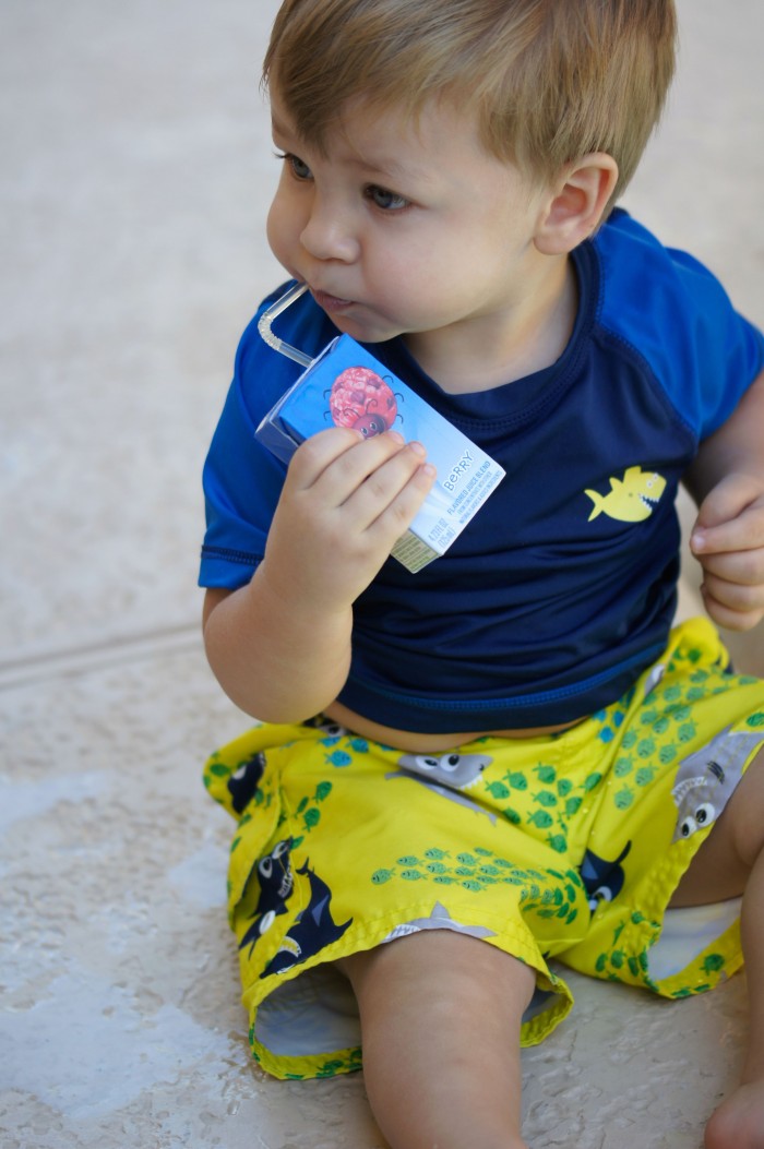 Looking for fun and free at home outdoor summer activities for kids? These DIY Juice Box Boats are a great way to take up an afternoon- build them by upcycling things from around the house and then set sail!