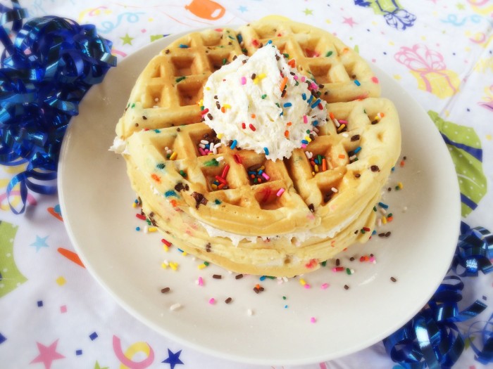 Every birthday needs a special celebration recipe- why not start the day off with these easy homemade Birthday Cake Waffles? They have the perfect toppings- whipped cream and sprinkles!- and they’re so pretty!