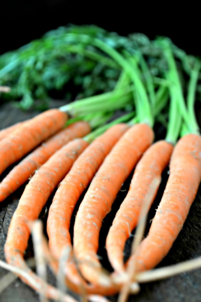 Need a delicious but simple side dish? Try this Easy Roasted Carrots recipe! This healthy cooked carrot recipe doesn’t use a brown sugar glaze- it amps up the flavor with honey, balsamic vinegar, and other great ingredients.