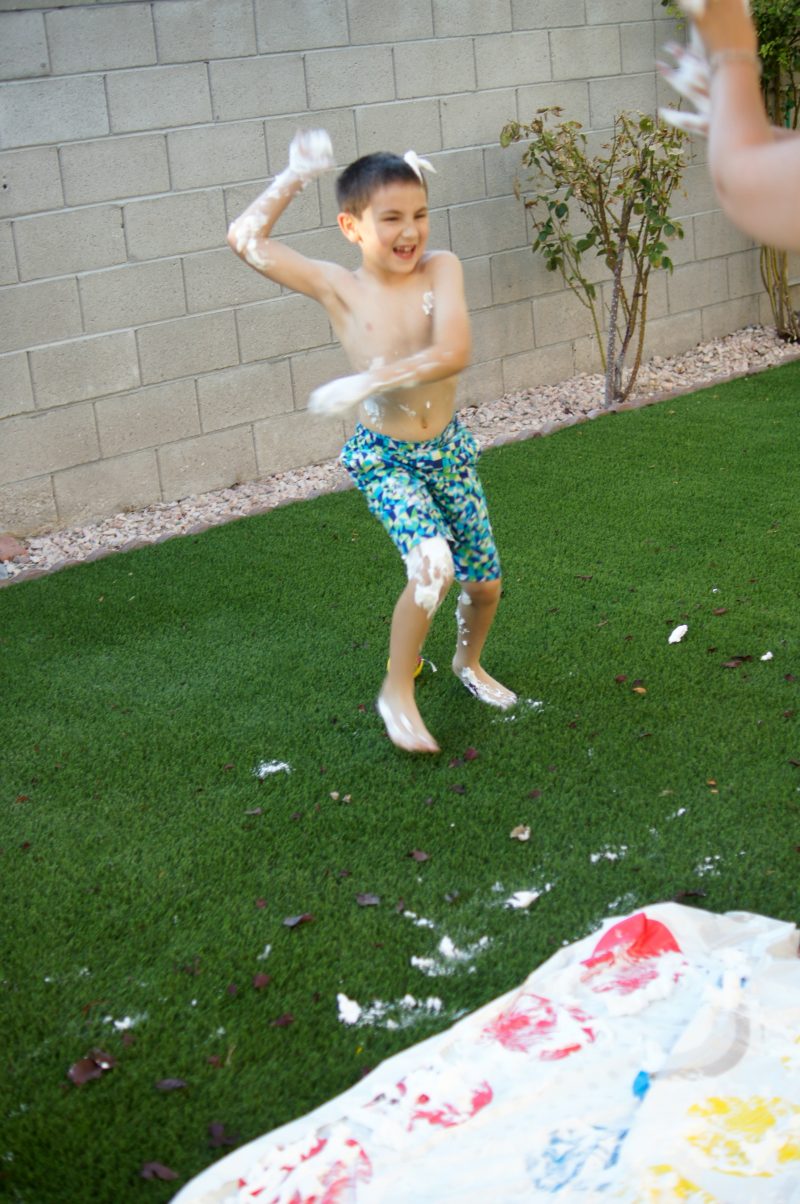 Need summer boredom buster ideas? Play Shaving Cream Twister! This DIY Backyard Game is easy to set up and brings so many giggles!