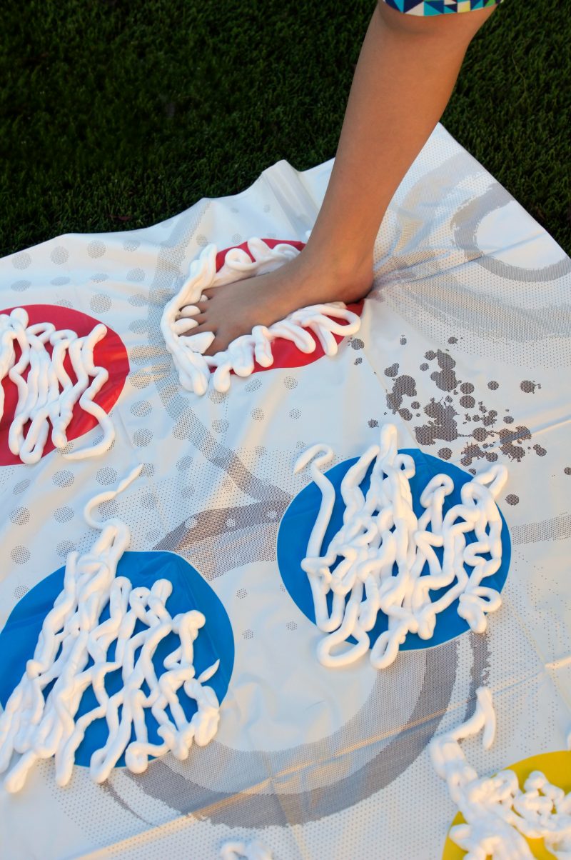 Need summer boredom buster ideas? Play Shaving Cream Twister! This DIY Backyard Game is easy to set up and brings so many giggles!