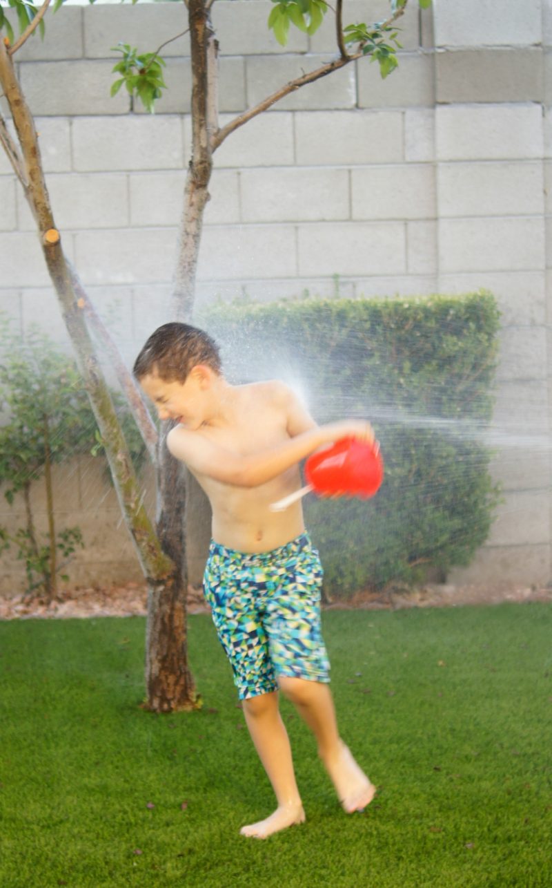 Need summer boredom buster ideas? Play Shaving Cream Twister! This DIY Backyard Game is easy to set up and brings so many giggles!