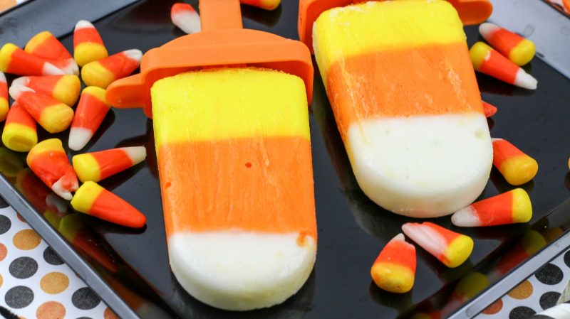 These Candy Corn Yogurt Pops are an easy, delicious way to get your fix of one of the best kinds of Halloween treats! These ice pops taste like desserts but are actually healthy, and are an easy recipe to enjoy- no baking required!