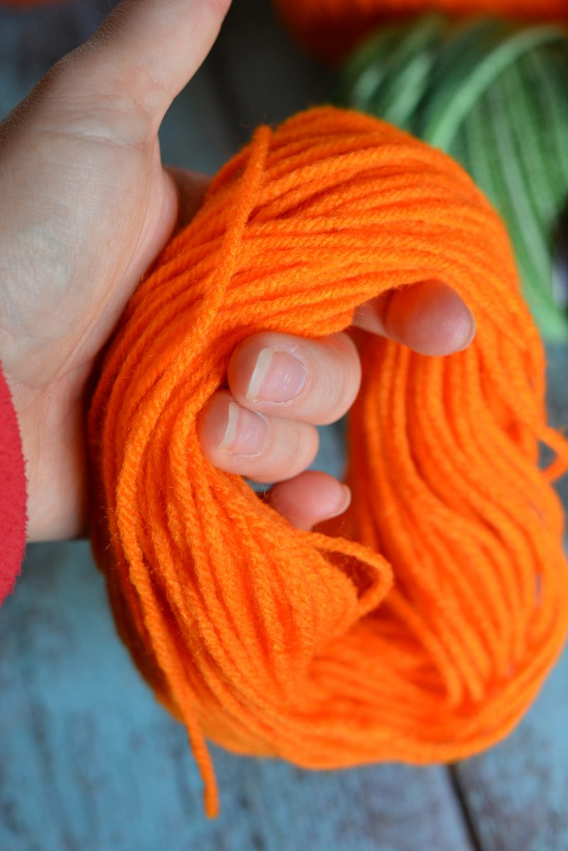 I love decorating my home with pumpkins because they work for both fall and Halloween- so they can stay up even longer! These DIY No Sew Yarn Pumpkins are so cute and so versatile- you can use them to make an easy pumpkin garland, use them in other crafts or projects, or just use them as decorations as they are!