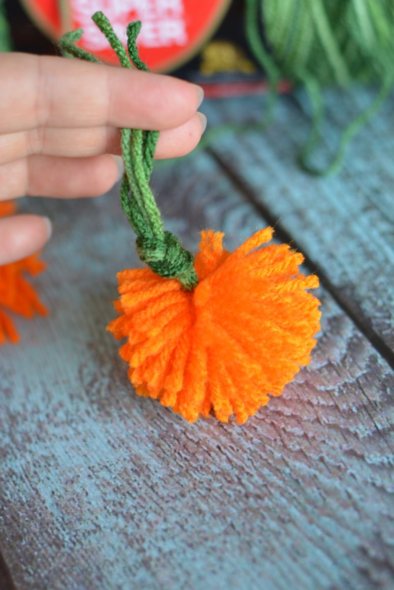 I love decorating my home with pumpkins because they work for both fall and Halloween- so they can stay up even longer! These DIY No Sew Yarn Pumpkins are so cute and so versatile- you can use them to make an easy pumpkin garland, use them in other crafts or projects, or just use them as decorations as they are!