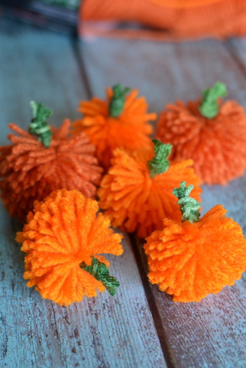 I love decorating my home with pumpkins because they work for both fall and Halloween- so they can stay up even longer! These DIY No Sew Yarn Pumpkins are so cute and so versatile- you can use them to make an easy pumpkin garland, use them in other crafts or projects, or just use them as decorations as they are!