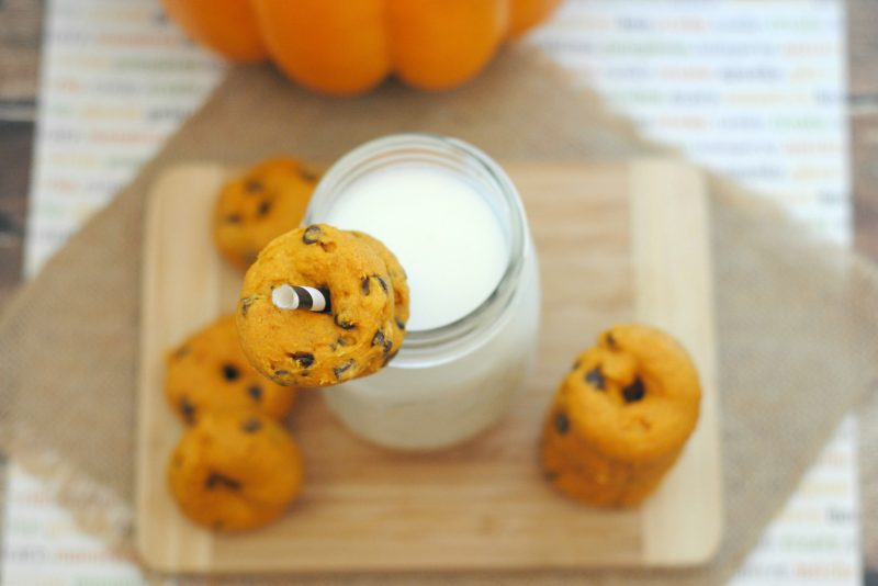 These Mini Pumpkin Chocolate Chip Donuts are so easy to make- and so delicious! The recipe starts with cake mix to make it even easier, so with just a few ingredients, you can have homemade, fresh baked donuts to enjoy this fall!