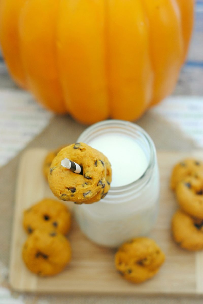 These Mini Pumpkin Chocolate Chip Donuts are so easy to make- and so delicious! The recipe starts with cake mix to make it even easier, so with just a few ingredients, you can have homemade, fresh baked donuts to enjoy this fall!