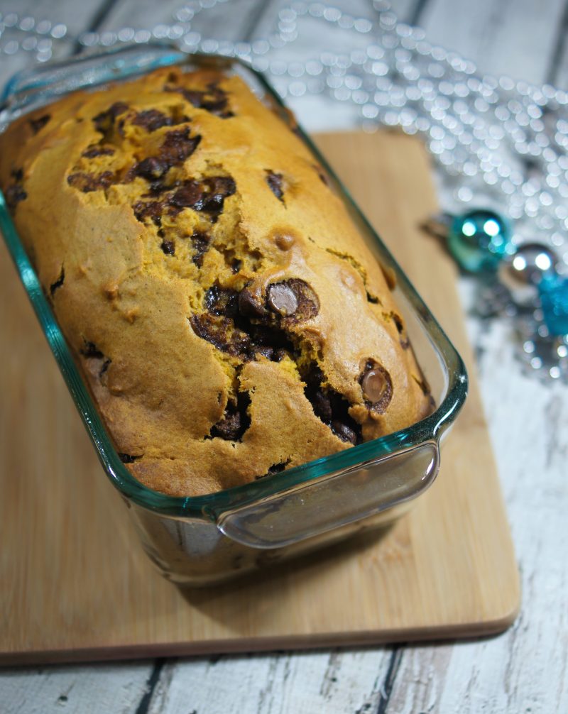 Need an idea for a great recipe to bake and gift this Christmas? Look no further- this easy recipe is for the best, most incredibly moist Pumpkin Chocolate Chip Bread! Totally loaded with chocolate chips, this bread will satisfy even the sweetest sweet tooth.