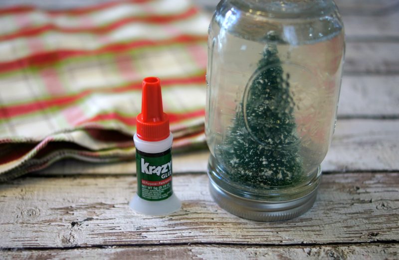 Christmas crafts don’t have to be hard! This easy DIY Snowglobe lets you use whatever cute decoration you want, along with a mason jar and some Krazy Glue, to make your own unique, homemade creation!