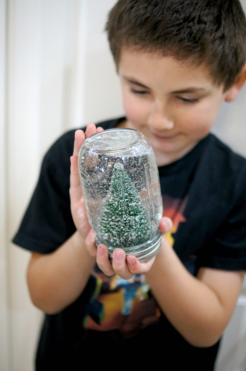 Christmas crafts don’t have to be hard! This easy DIY Snowglobe lets you use whatever cute decoration you want, along with a mason jar and some Krazy Glue, to make your own unique, homemade creation!