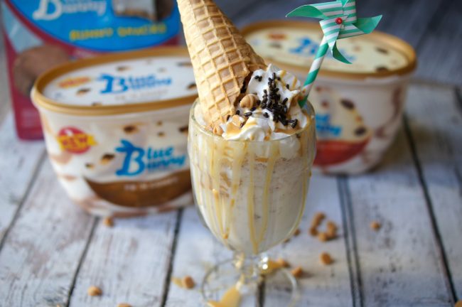 Have you ever had an extreme milkshake? They are popping up in restaurants around the world and each one of the ideas is more crazy than the next! Now you can DIY one at home, whether for parties or just desserts! This Extreme PB ‘N Cones Milkshake recipe is filled with peanut buttery goodness, a touch of chocolate sweets, and a real ice cream cone on top!