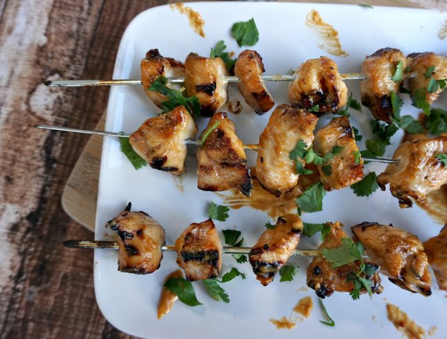 Looking for a great summer recipe you can throw on the grill? Check out this Grilled Chicken Kebabs with Spicy Peanut Sauce recipe! They’re super easy- just marinade the chicken, make a three ingredient sauce, put the chicken on skewers and pop them on the grill!