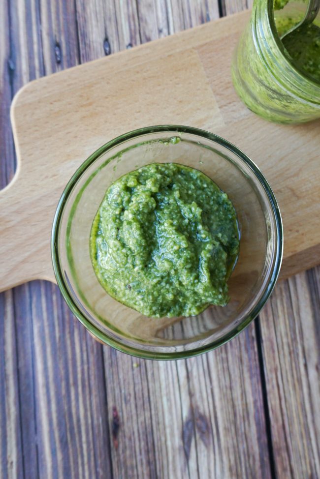 Pesto is a delicious sauce featuring fresh basil that you can use on all kinds of dishes, including chicken, pasta, risotto, and even pizza! This easy homemade pesto recipe shows you how to get fresh and delicious pesto in just one step!