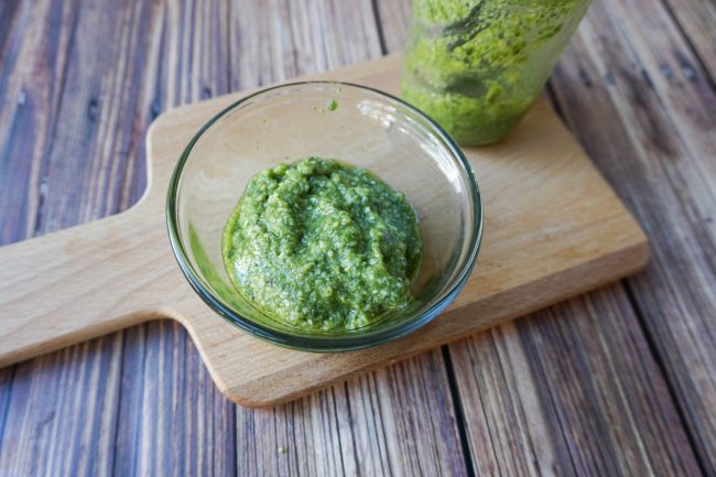 Pesto is a delicious sauce featuring fresh basil that you can use on all kinds of dishes, including chicken, pasta, risotto, and even pizza! This easy homemade pesto recipe shows you how to get fresh and delicious pesto in just one step!