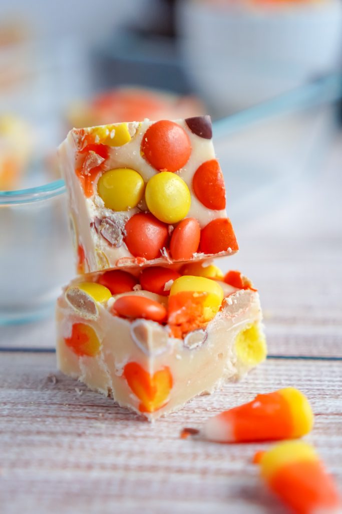 Homemade fudge is a delicious Christmas tradition- but you can make it for other holidays too, like Halloween! This easy White Chocolate Candy Corn Fudge recipe is perfect for fall and even has some peanut butter in the form of Reese’s Pieces.