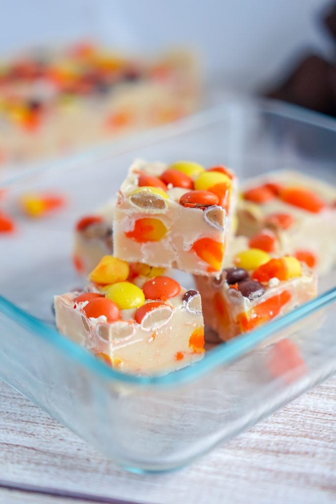 Homemade fudge is a delicious Christmas tradition- but you can make it for other holidays too, like Halloween! This easy White Chocolate Candy Corn Fudge recipe is perfect for fall and even has some peanut butter in the form of Reese’s Pieces.