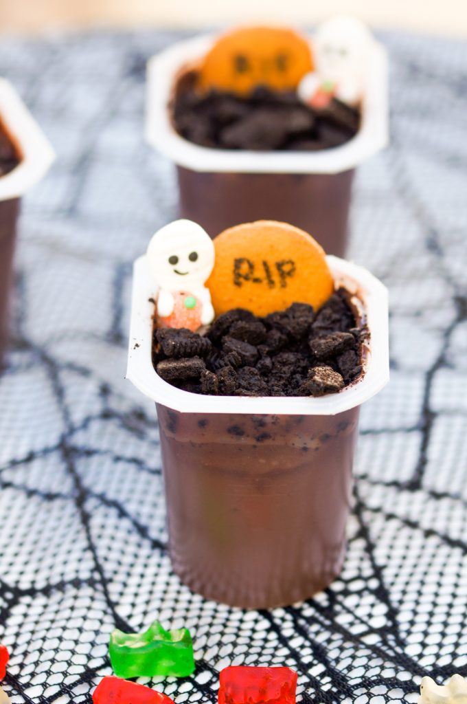 Looking for delicious and easy Halloween treats ideas? These adorable Graveyard Pudding Cups make great snacks or desserts- and they’re so simple!