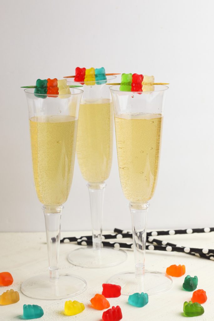 Need a non alcoholic kid friendly mocktail recipe for New Year’s Eve or other special celebrations? You won’t find one easier than this! With just two ingredients- three if you add the optional gummy bear garnish- you’ll ring in the New Year in style and celebrate!