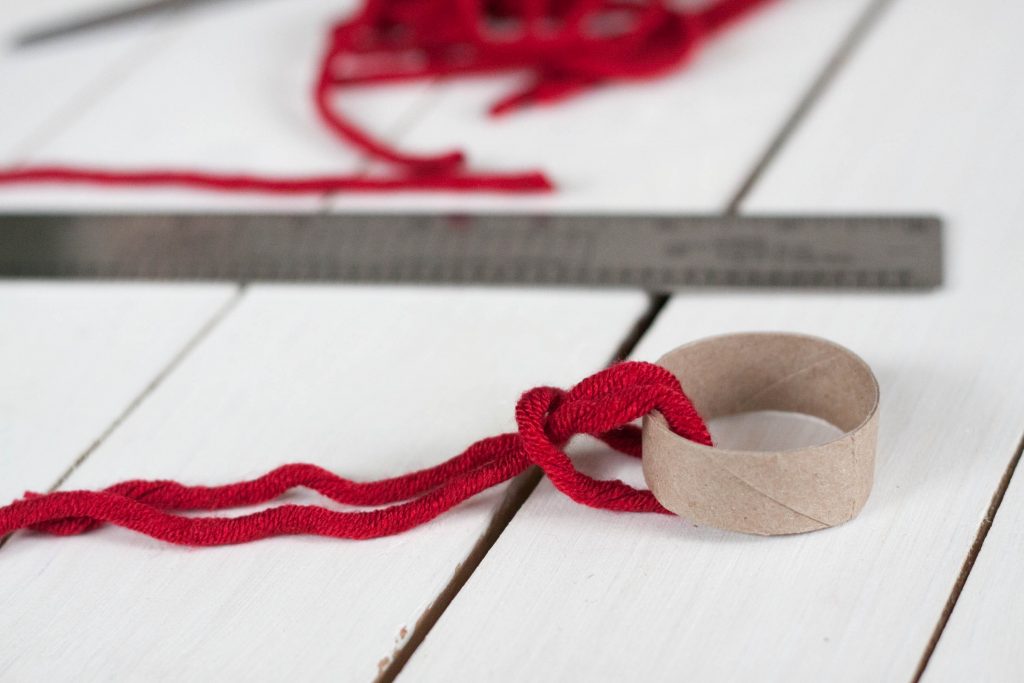 Love making unique and personalized handmade ornaments with your kids? This easy rustic DIY winter hat ornament is adorable and so fun to make for Christmas!