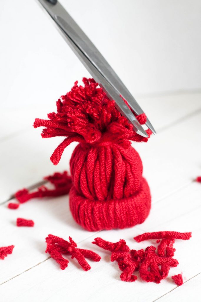 Love making unique and personalized handmade ornaments with your kids? This easy rustic DIY winter hat ornament is adorable and so fun to make for Christmas!