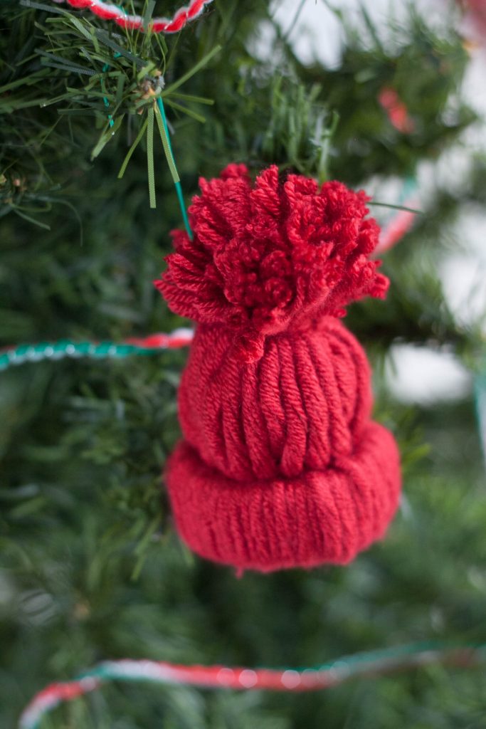 Love making unique and personalized handmade ornaments with your kids? This easy rustic DIY winter hat ornament is adorable and so fun to make for Christmas!