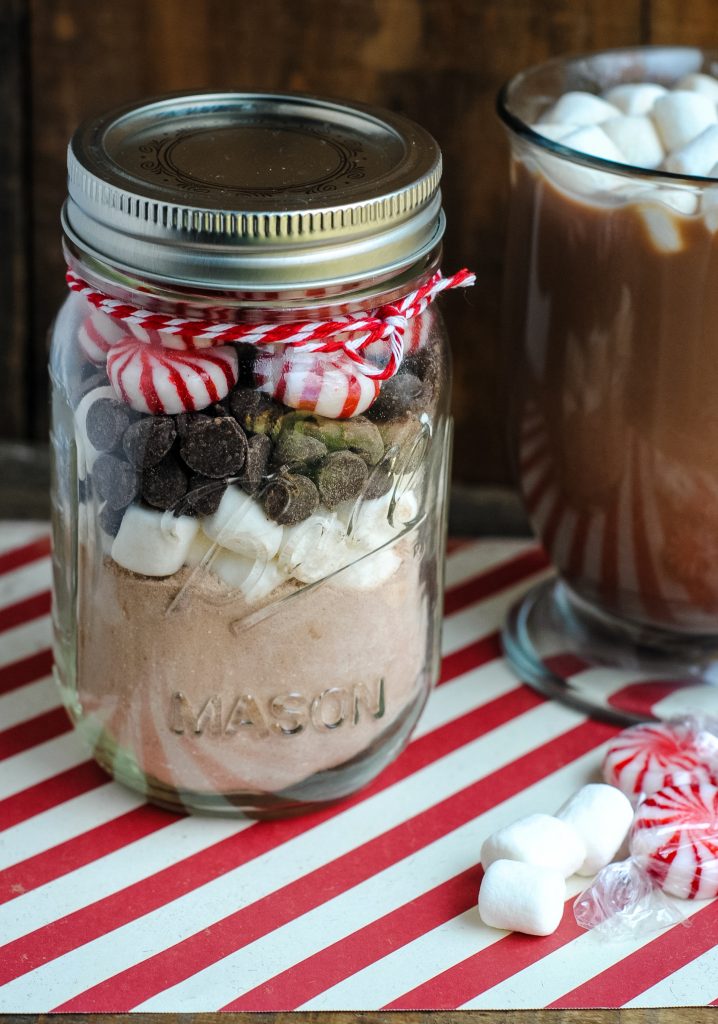 Christmas gifts are fun to give, but when you have to think of ideas for teachers, for coworkers, and for friends- it adds up fast. This easy DIY Gift in a Jar recipe is a great- and cheap- way to give a small food gift to those you love at the holidays. {It’s great for women and even for teens!}