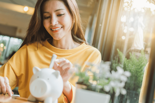 woman saving money in a piggybank