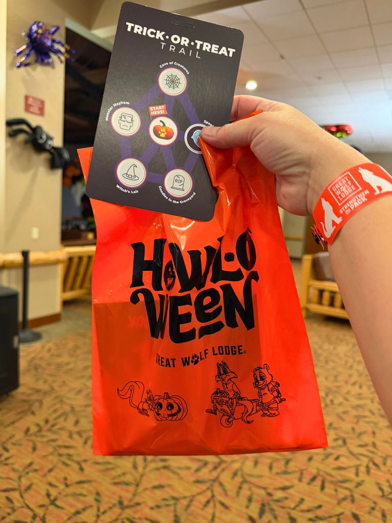 Orange Great Wolf Lodge Howl-O-Ween trick-or-treat bag and Trick-or-Treat trail passport Must Do Halloween Activities for Kids in Southern California: Great Wolf Lodge Garden Grove Howl-O-Ween